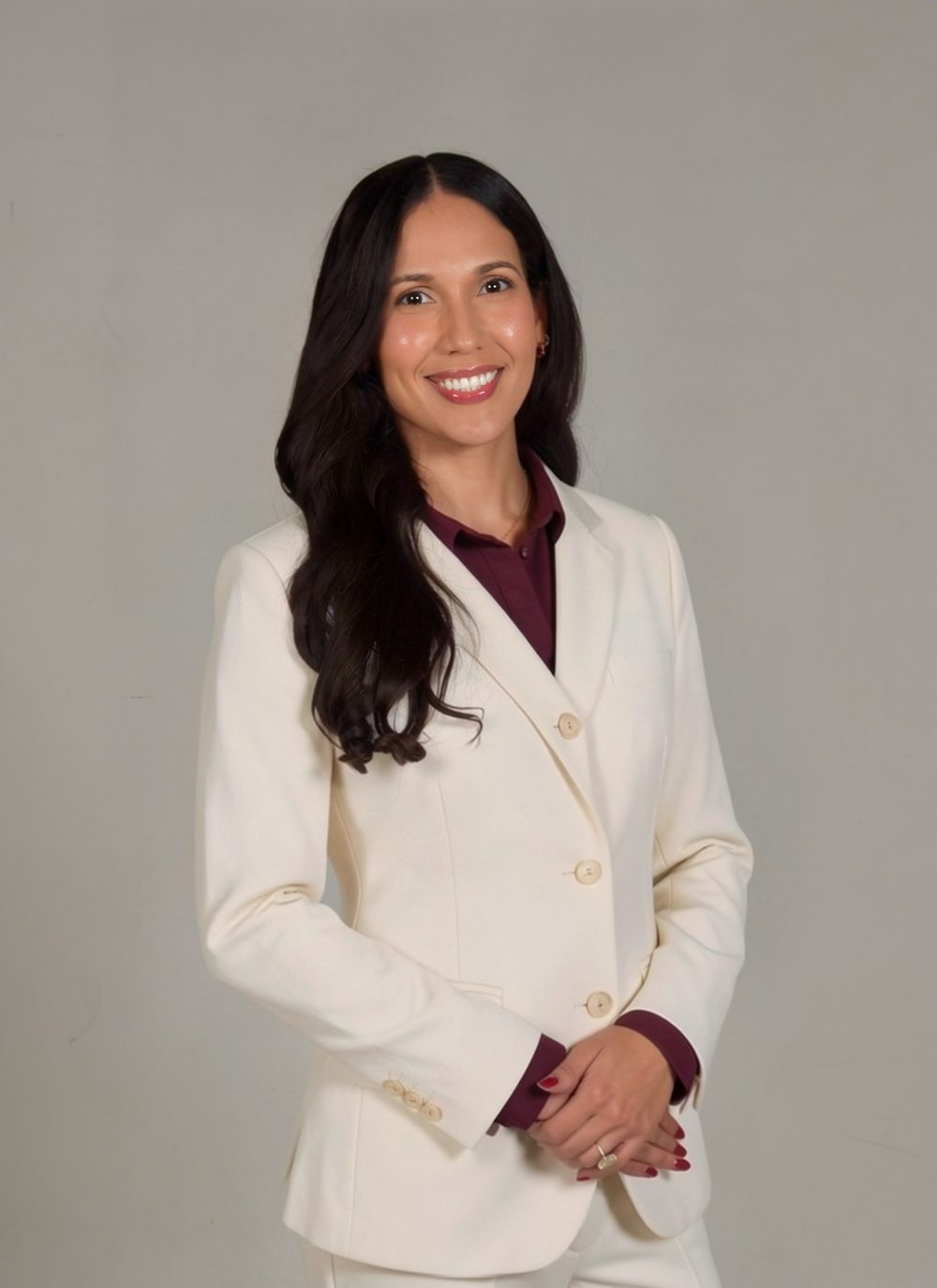 Dr. Solymar Torres Maldonado in a white coat